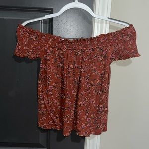 Orange off the shoulder top with floral pattern